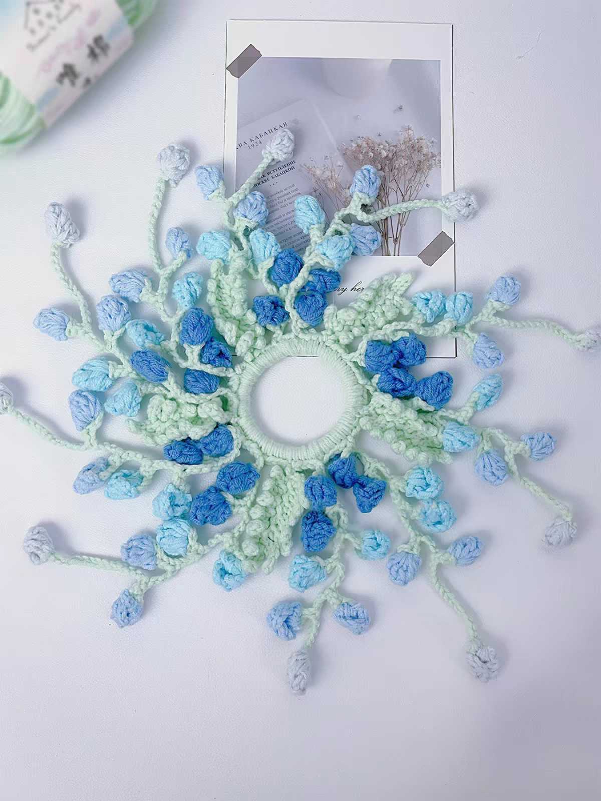 Close up of cotton yarn crochet flower hair scrunchie texture