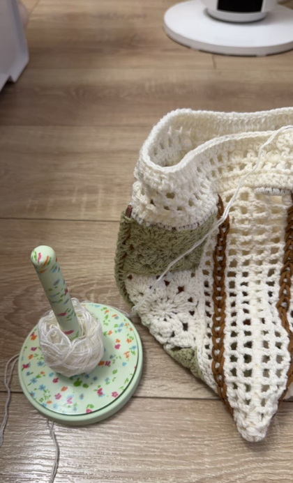 Close-up of handmade crochet lace texture for a patchwork bag