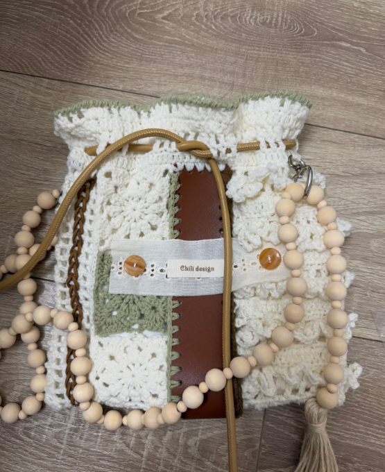 Handmade crochet bag detail showing soft cotton yarn texture
