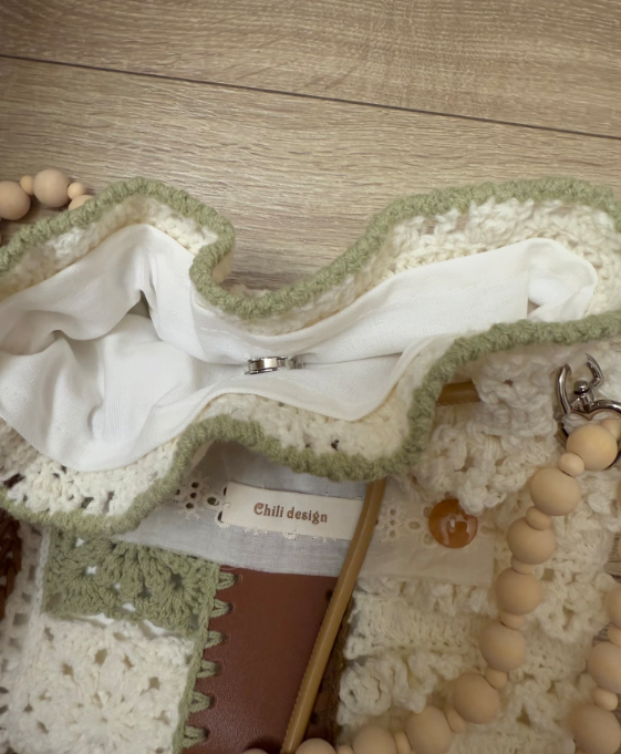 Inside detail of a handmade crochet crossbody bag with soft lining