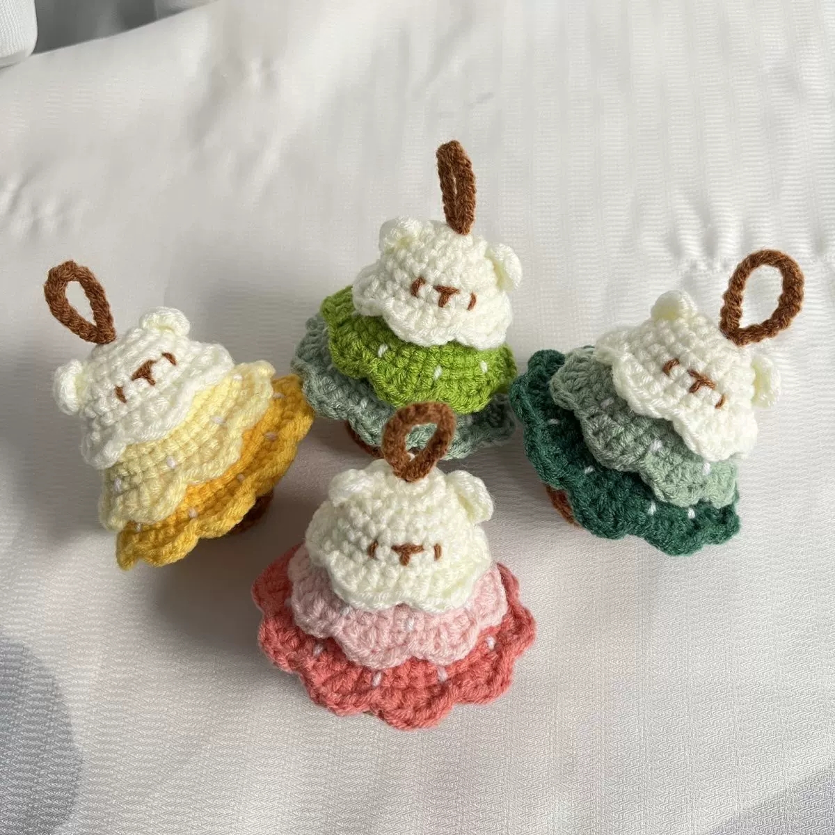 Colorful handmade crochet charms made with soft yarn
