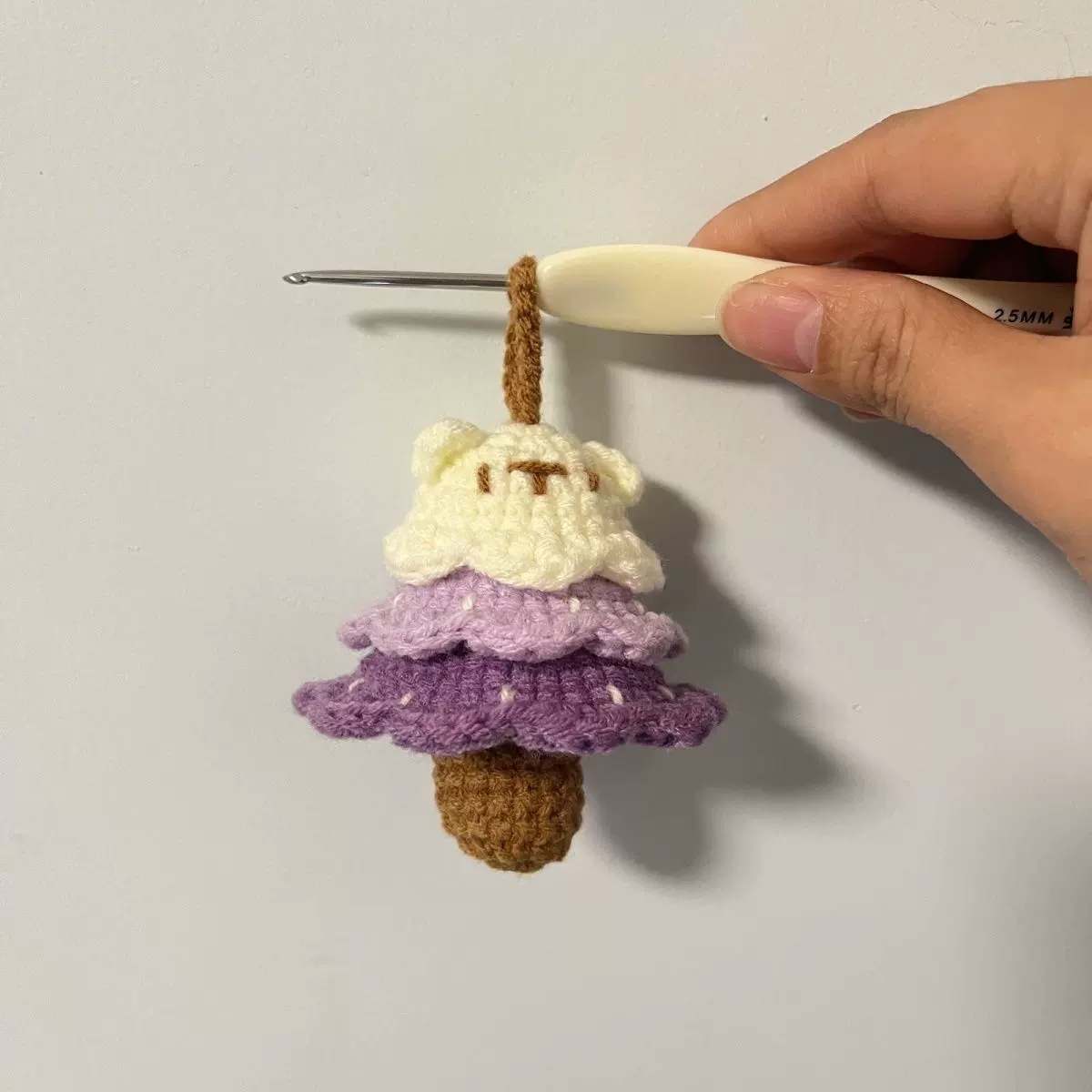 Yellow handmade crochet charm made with soft yarn