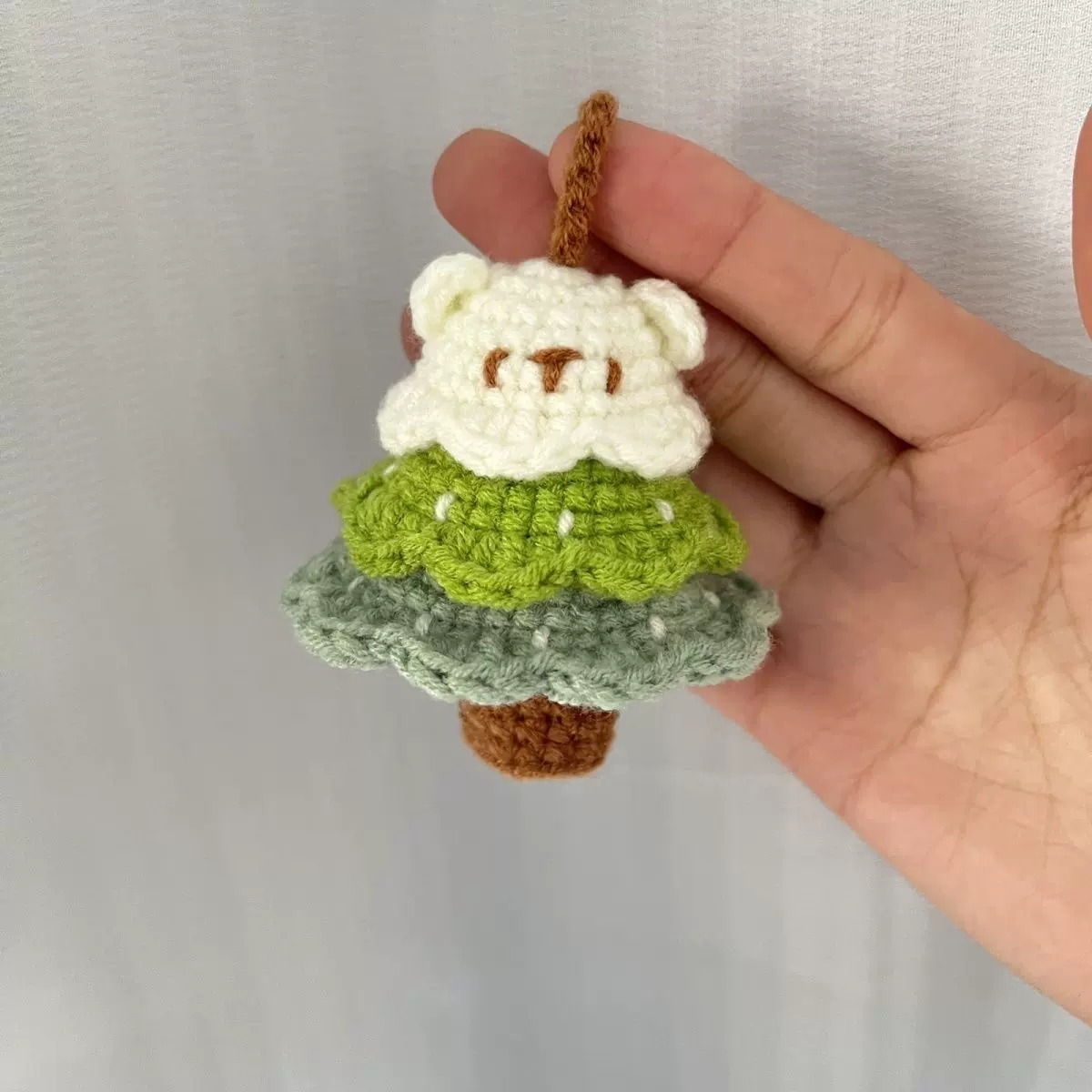 Soft green and blue handmade crochet charm