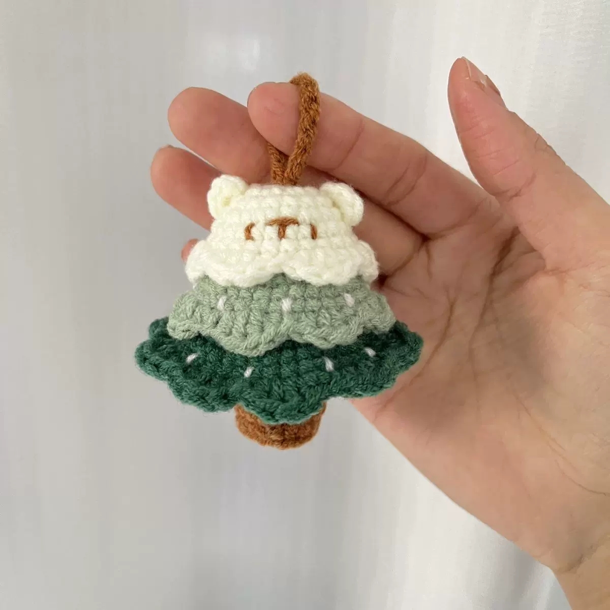 Close detail of a handmade crochet charm loop